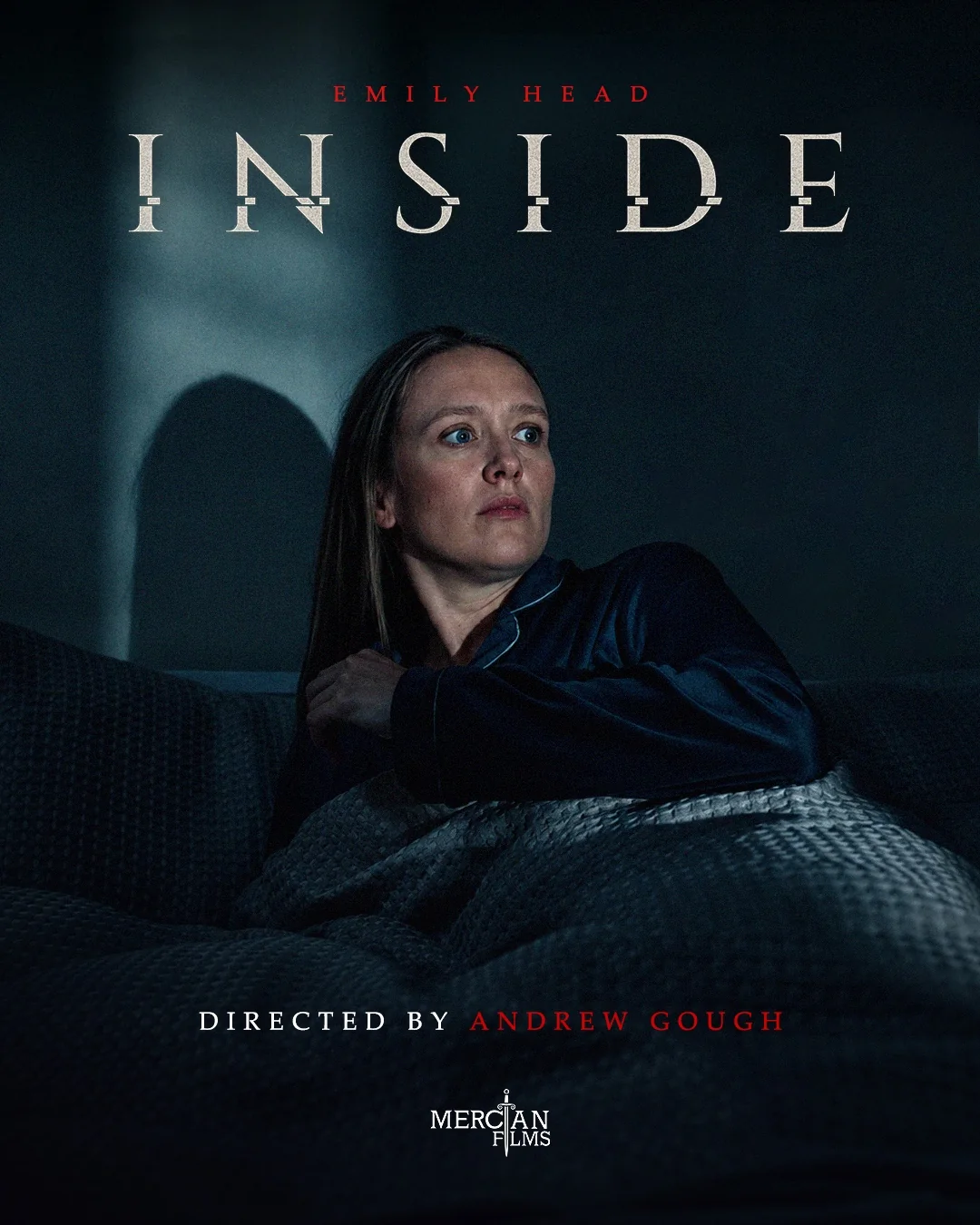 INSide poster: Emily Head wrapped in a blanket in a dark room